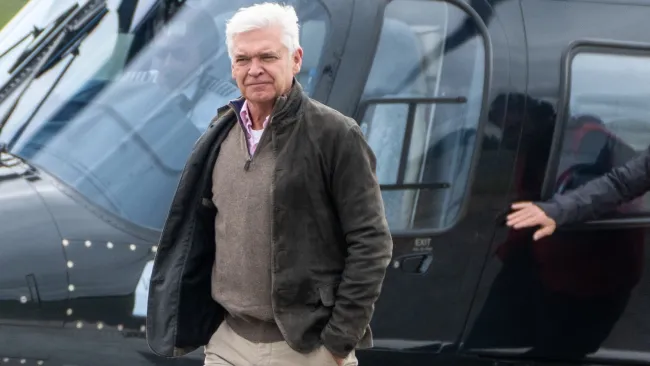 Phillip Schofield makes rare public appearance arriving at Grand Prix at Silverstone in helicopter