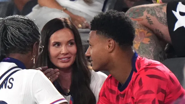 Ollie Watkins and girlfriend Ellie Alderson share a passionate kiss after England victory