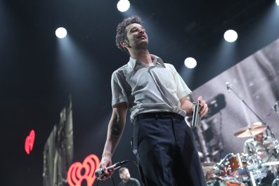 The 1975 Sued After Matty Healy Kiss