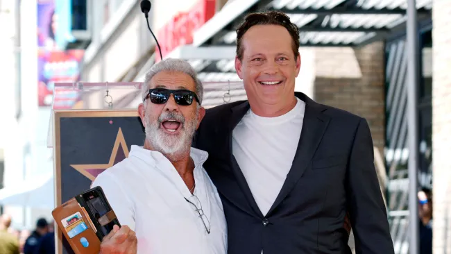 Mel Gibson looks like someone’s uncle on holiday as he interrupts actor’s star moment to take selfie