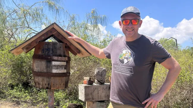 Man is hand delivering letters from the Galapagos Islands all over the world