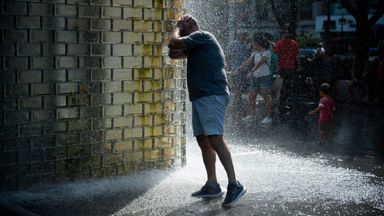 Early dismissal, cold towels, water handouts - how Americans are coping in scorching heatwave