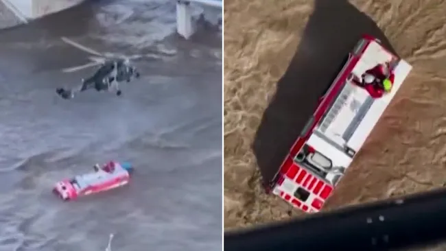 Daring helicopter rescue of firefighters stranded on truck swallowed by floods