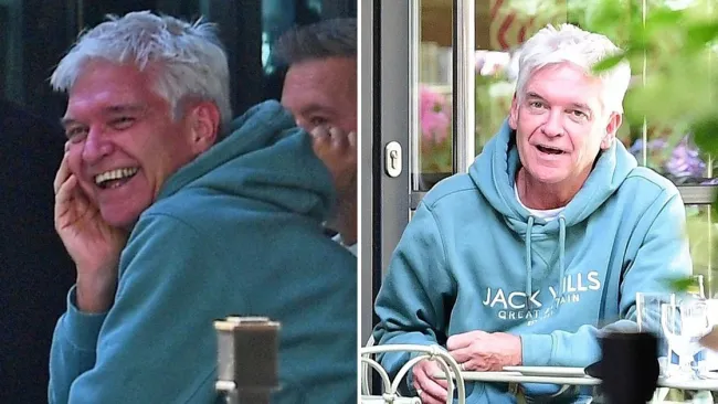 Phillip Schofield pictured looking jubilant while still wearing wedding ring