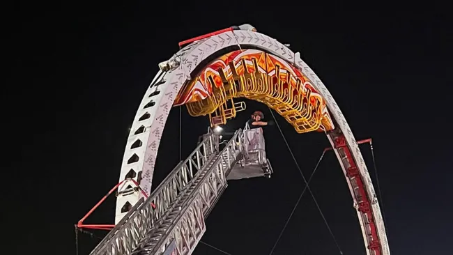 Moment thrill seekers are rescued from upside-down rollercoaster