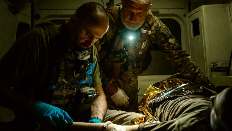 Blacked-out ambulances and bomb-cratered roads: On the night shift with Ukraine's military medics