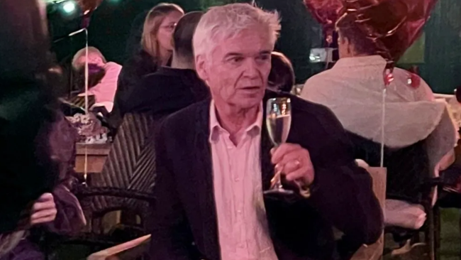 Phillip Schofield sips on champagne at engagement party as suspense builds around TV comeback